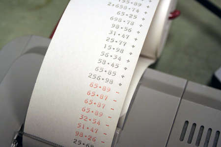 Adding machine tape showing some numbersの写真素材