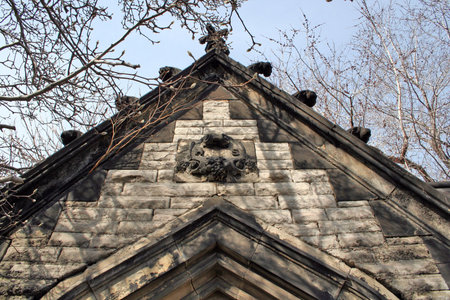 A spooky looking top of a old mausoleum. Dated from the 1800's from Erie Street cemetery in Cleveland Ohioの写真素材