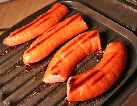 Grilling some kielbasa on the grillの写真素材
