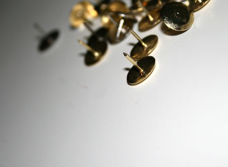 Thumbtacks with the focus on the the points of the front tacks.の写真素材