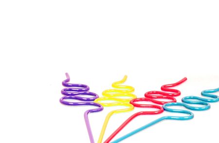 Party Straws with Copy Space is a capture of purple, yellow, red and blue curvy party straws isolated over a white background.の写真素材