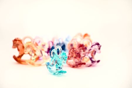 Herd of Rocking Horses isolated on a white background.の写真素材