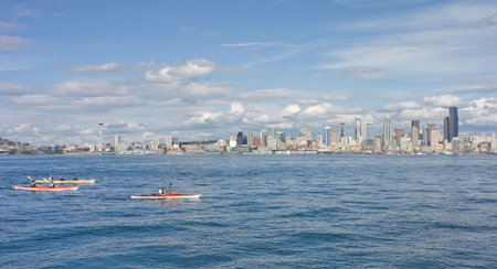 Seattle Space Needle Skyline with Kayakers as viewed from across the Puget Sound at Alki.