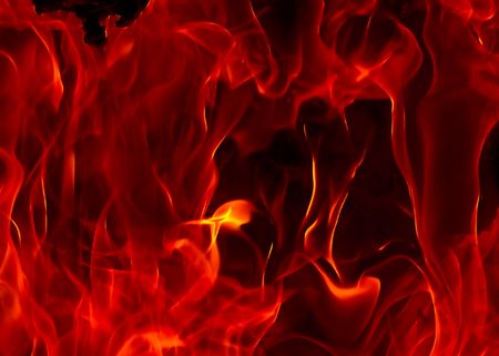 Red Fire Flames of Hell against a black background.の写真素材