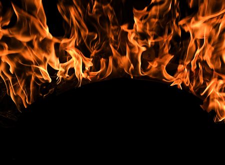 Red Fire Flames of Hell against a black background.の写真素材