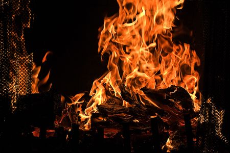 Red Fire Flames of Hell against a black background.の写真素材