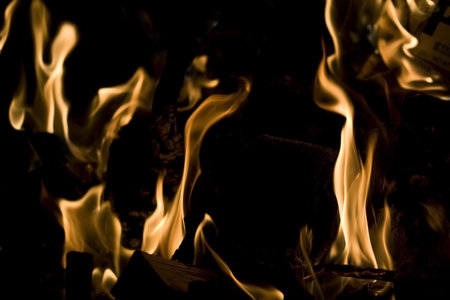 Flames of Fire in a Fireplace against a black Background 