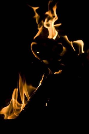 Flames of Fire in a Fireplace against a black Background 