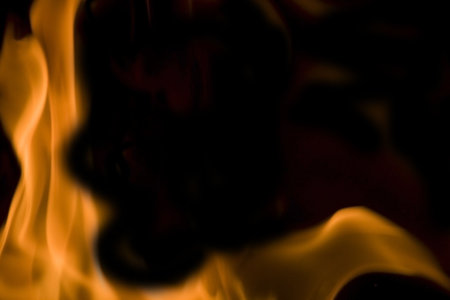 Flames of Fire in a Fireplace against a black Background 
