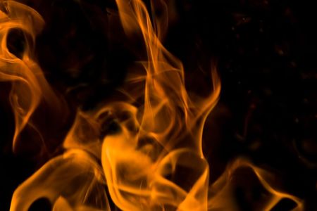 Flames of Fire in a Fireplace against a black Background の写真素材