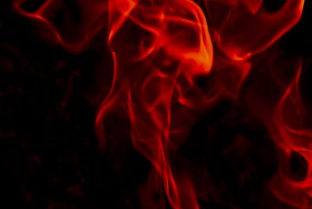 Flames Fire of Hell against a black background. の写真素材