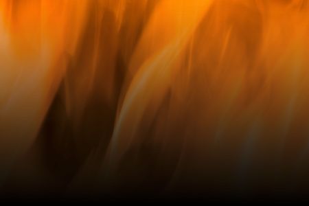 Flames of Fire in a Fireplace against a black Background の写真素材