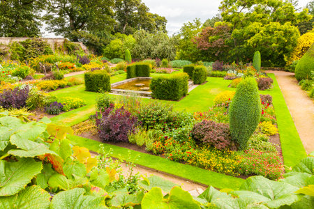 Crathes - August 2014 : Crathes gardens scotland in summer. an open-air living room immersed in the greenery where a lot of tourists take a sit after visit the homonymous castleのeditorial素材