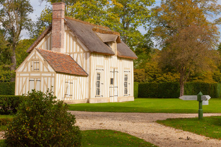 Chantilly September 2012 - In September, many tourists visit the Anglo-Chinese garden in Chantilly Castle to walk  in nature and admire the well kept grass. Thi is a rustic house of the garden.のeditorial素材