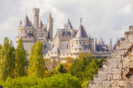 September 2012- In September a lot of tourist visit the Medieval Castel of  Pierrefond in the north of Paris in France restored by Viollet-le-Duc to enjoy its architecture.  View of the castle from the nearby forestのeditorial素材