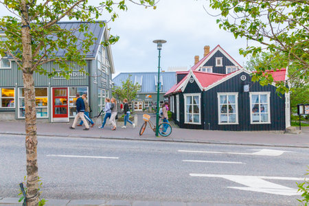 Reykjavik June 2013  Street view in Reykjavik with typical icelandic wooden coloured houses. In this period visitors can be assist at the visitor centre of the town to receive any information of the city tours.のeditorial素材