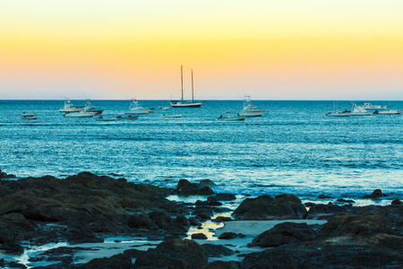 boats moored offshore at sunset Costa Ricaの写真素材