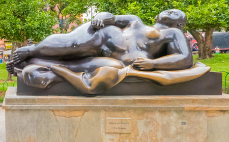 Medellin January 2018 This bronze statue representing a recumbent woman was created by the artist Fernando Botero and donated by himself to the Antioquia museum in Medellin where it is now exhibited.のeditorial素材