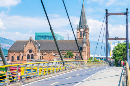 Medellin February 2018 This church called Sacred Heart of Jesus is a meeting point for Medellin residents to pray and eat some snacks in the nearby stalls. View from pedestrian bridge.のeditorial素材