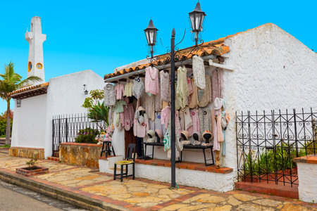 Guatavita,  Colombia June 16 Small shop of wool clothing welcomes visitor in the old village of Guatavita built in 1590. These handmade clothes are the symbol of the city. Shoot on June 16, 2019のeditorial素材