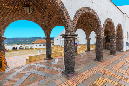 Guatavita,  Colombia June 16 Ancient stone porch in the historic center of Guatavita. This village was built in 1590 by the spanish. Its buildings are all white well kept and located in a pedestrian area. Shoot on June 16, 2019のeditorial素材