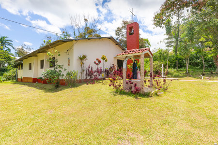 Panama La Concepcion, May 9, San Vicente parish with its characteristic bell tower and the monument to the patron saint of children. Shoot on May 9, 2021のeditorial素材