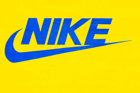 Panama David, June 8, Nike symbol in blue on the yellow background of an external wall of a clothing...
