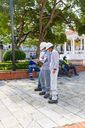 Panama, David town, some technicians from the local electricity company consult the laptop during a technical intervention. Shoot on September 8, 2021のeditorial素材