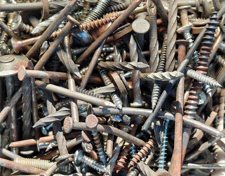Old nails and screws or bolts and nuts. Top view, industrial background. Home improvement.の写真素材