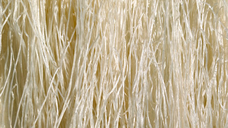 Dry or raw noodles pattern. Asian noodle food. White Mixian rice noodles background. Restaurant concept.の写真素材