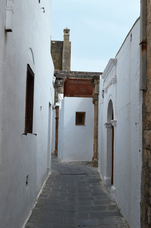 Alley in Greece, narrow, white with charm. This is the standard in Greece, such as are alleys are in every townの写真素材