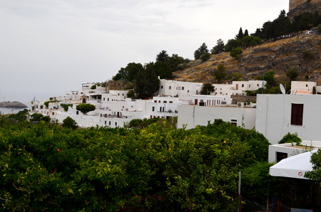 View of the Greek town in Rhodes. Greek style can be seen immediately. White houses on the background of the sea.の写真素材