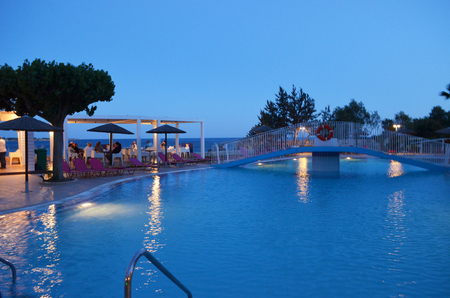 A beautiful Greek by the pool next to the sea, in Greece.の写真素材