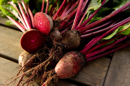Fresh organic beets just picked from the garden shot on a wood table.の写真素材