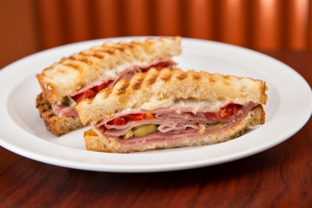 An Italian deli classic ham salami and provolone sandwich on sourdough bread.の写真素材