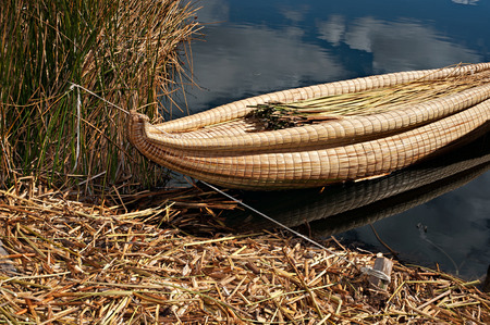 Looking at a traditional reed boat on lake Titicaca Peru.  This is tied down on the island of Uros.の写真素材