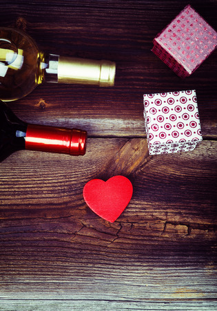 Red Wooden Heart, Bottles Of Wine, Gift Boxes And On Wooden Board. Love Concept. Valentines Day Background.の写真素材
