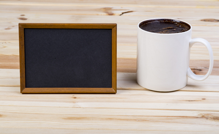 Big Cup Of Coffee With Blank Blackboard On Wooden Boardsの写真素材