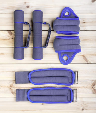 Sport Equipment. Dumbbells, Ankle Weights And Wrist Weights On Boards. Sport Fitness Backgroundの写真素材