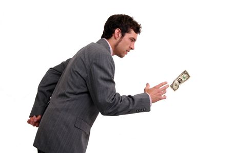 A businessman chasing a dollar billの写真素材