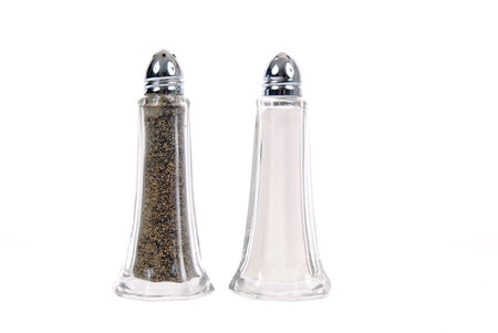 Glass salt and pepper shakers on white backgroundの写真素材