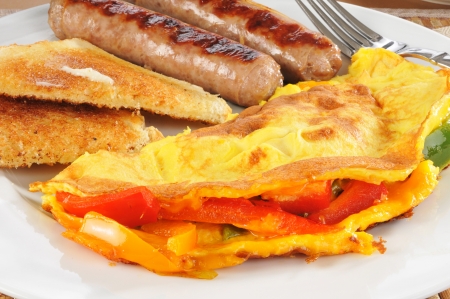 Closeup of a western omlet with sausage and toastの写真素材