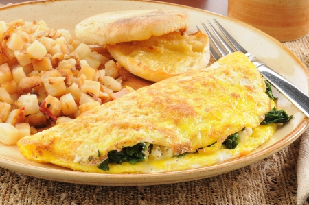 Close up of a spinach and feta cheese omelet with an english muffinの写真素材