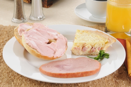 Ham an cheese quiche lorraine with a bagel and strawberry cream cheeseの写真素材