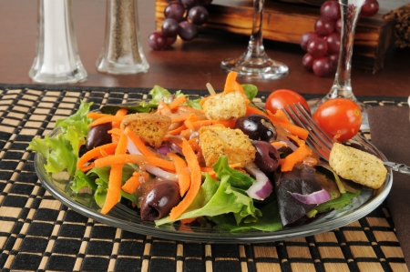 A garden salad with black and Greek olivesの写真素材