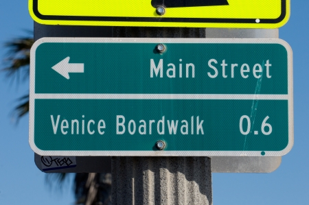 Signs marking the main street walkway on Santa Monica beach and the upcoming Venice Beach Boardwalkの写真素材