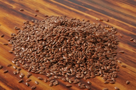A mound of flax seed on a cutting boardの写真素材