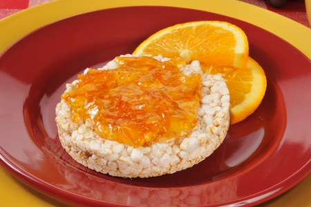A rice cake with orange marmalade spreadの写真素材