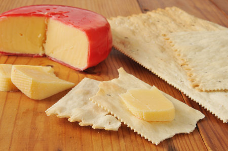 gouda cheese slices on gourmet flatbread crackers.  Shallow depth of field
