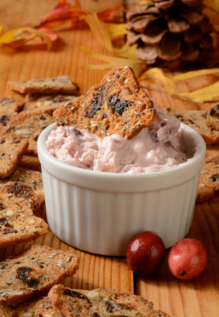 Cranberry orange cheese spread with sweet fruit and nut infused crackersの写真素材